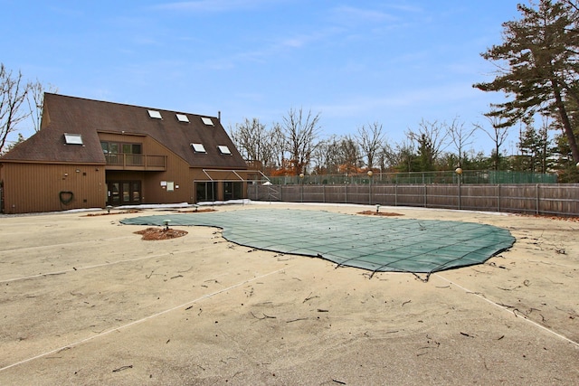 view of pool featuring a fenced in pool, a patio, and fence