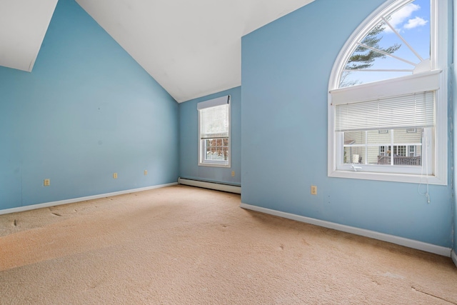 spare room with carpet floors, high vaulted ceiling, baseboards, and a baseboard radiator