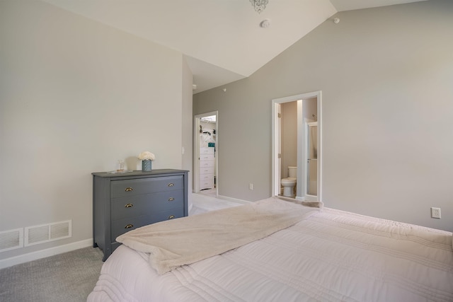 bedroom with visible vents, ensuite bath, baseboards, light colored carpet, and a spacious closet