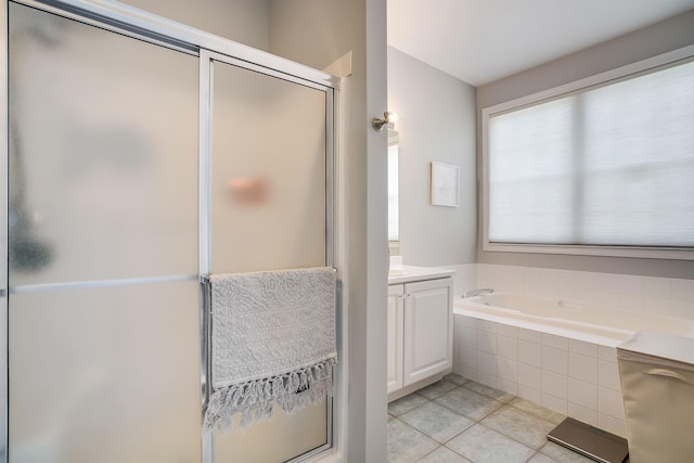 bathroom featuring tile patterned floors, a shower stall, vanity, and a bath