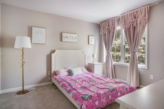 bedroom with carpet flooring and baseboards