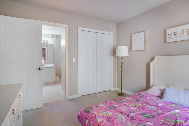 bedroom featuring light carpet, baseboards, and a closet