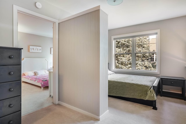 bedroom featuring baseboards and carpet flooring