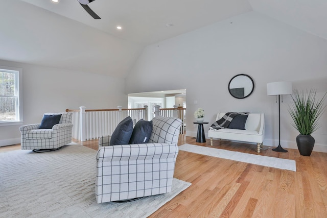 living area with ceiling fan, baseboards, wood finished floors, and recessed lighting