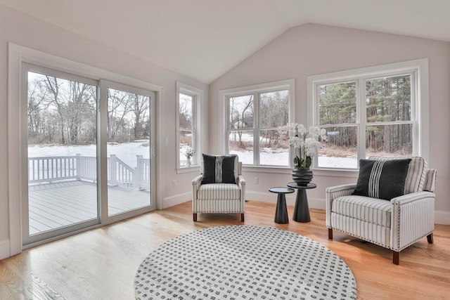 sunroom featuring vaulted ceiling