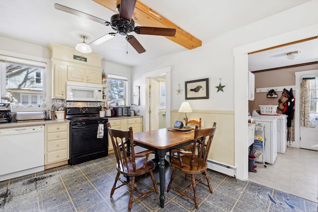 dining area with a ceiling fan, beam ceiling, wainscoting, a baseboard heating unit, and washing machine and dryer