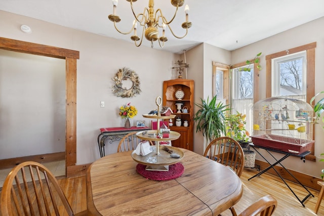 dining room featuring an inviting chandelier and wood finished floors