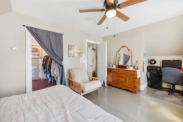 bedroom featuring wood finished floors, a ceiling fan, and vaulted ceiling