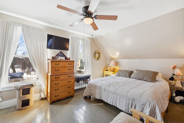 bedroom featuring hardwood / wood-style floors, lofted ceiling, ceiling fan, and a baseboard radiator