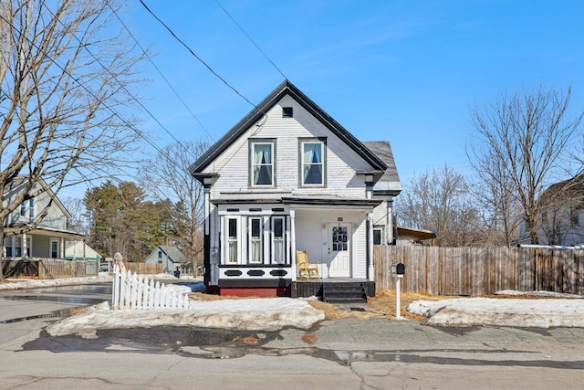 victorian home with fence