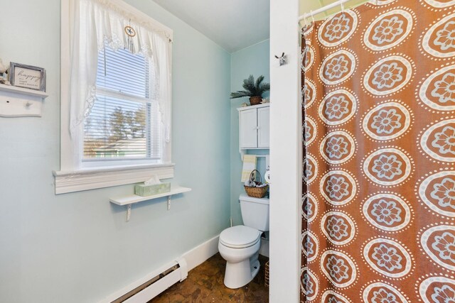 full bathroom with curtained shower, baseboards, baseboard heating, and toilet