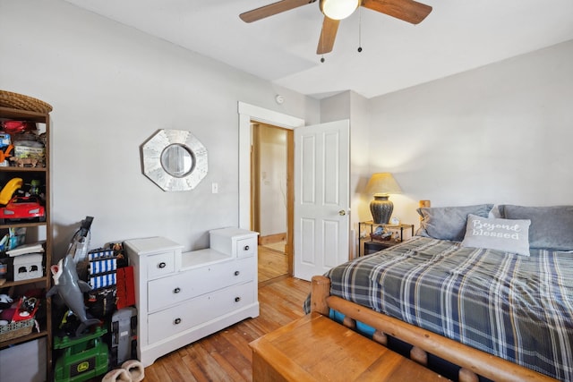 bedroom featuring a ceiling fan and wood finished floors