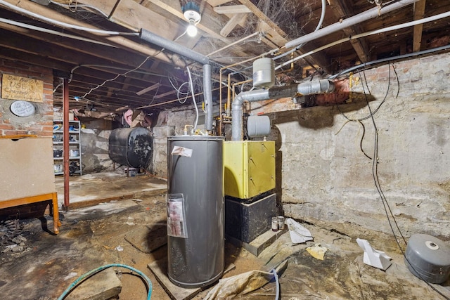 utility room with electric water heater and heating fuel