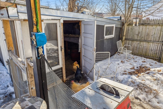 view of shed with fence