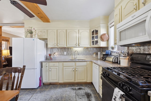 kitchen featuring white appliances, beam ceiling, a sink, light countertops, and tasteful backsplash