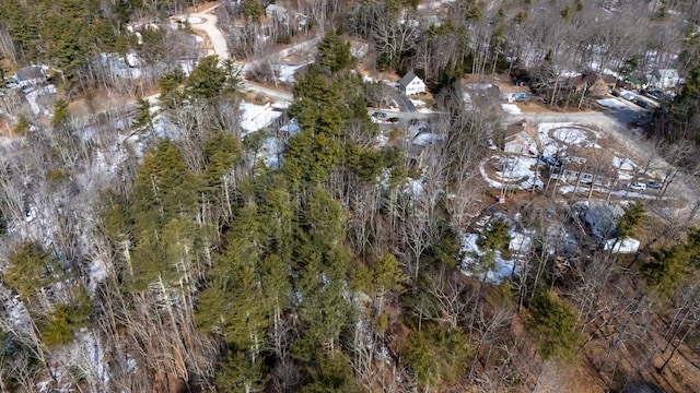 birds eye view of property with a forest view