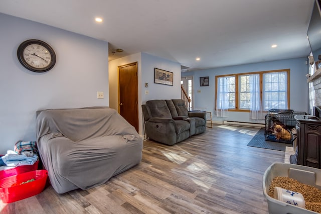 living area featuring stairway, recessed lighting, and wood finished floors