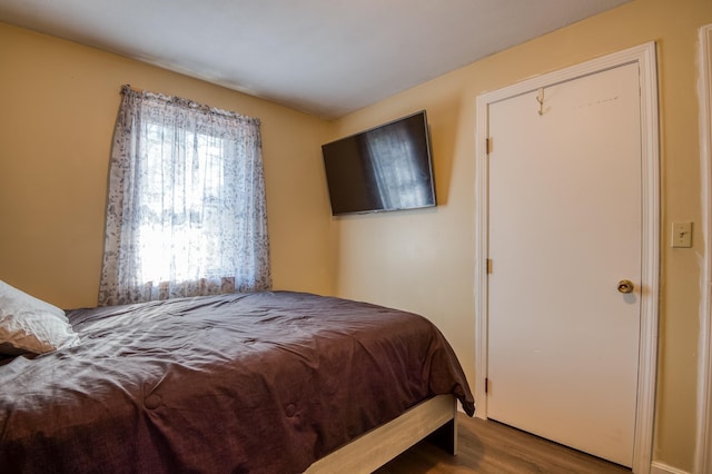 bedroom featuring wood finished floors