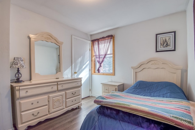 bedroom with light wood-style floors