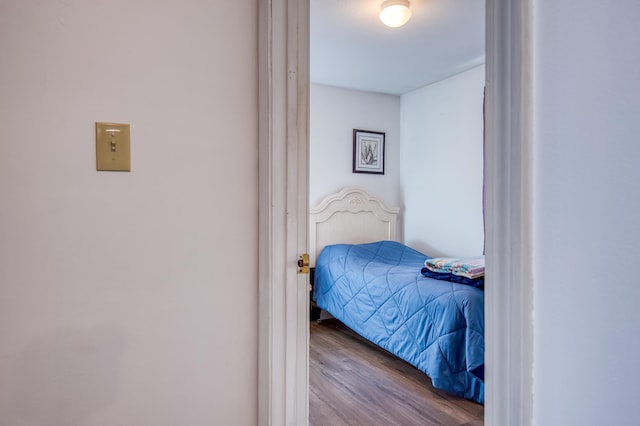 bedroom featuring wood finished floors