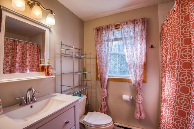 full bath with vanity, toilet, and baseboard heating