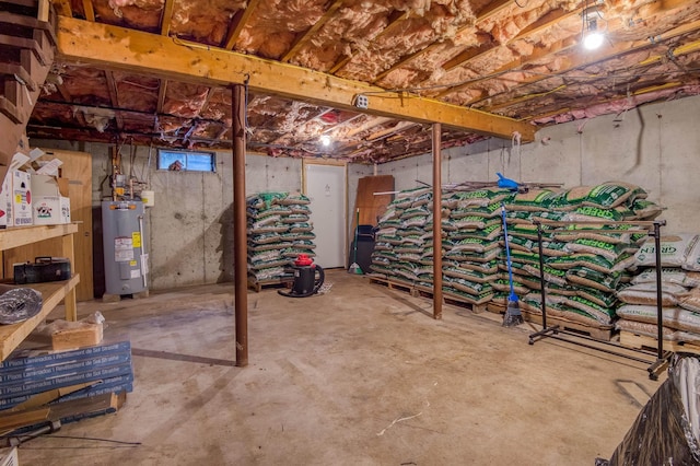 unfinished basement featuring electric water heater