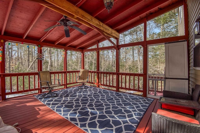 sunroom with wooden ceiling, ceiling fan, and vaulted ceiling with beams