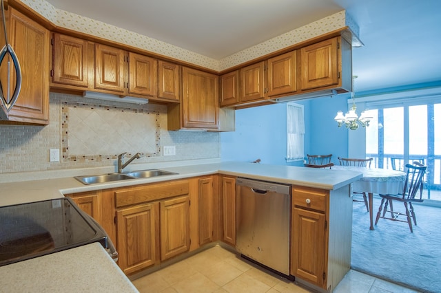 kitchen featuring dishwasher, light countertops, brown cabinets, a peninsula, and a sink