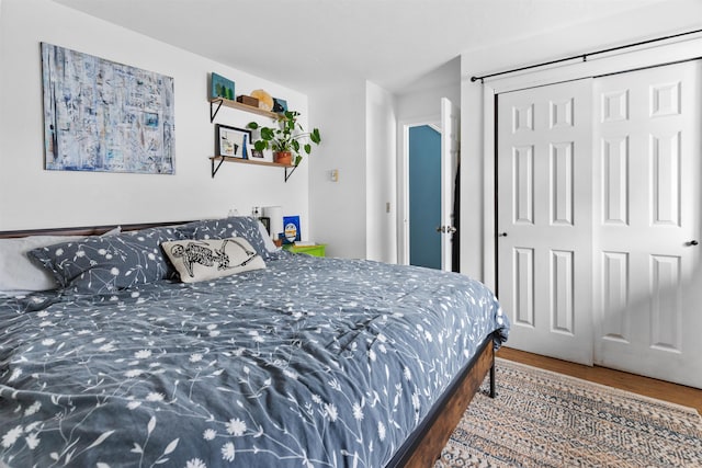 bedroom featuring a closet and wood finished floors