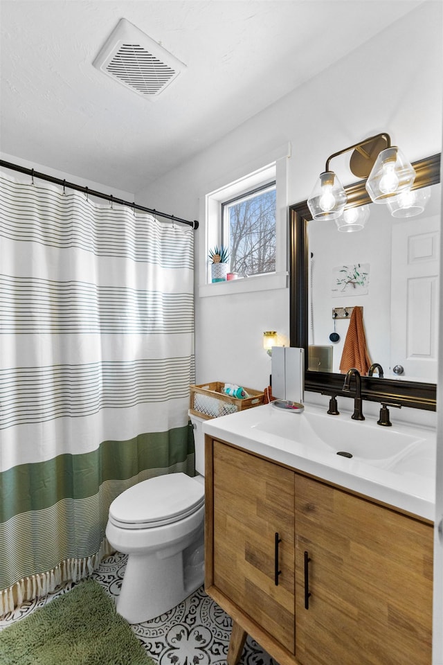 full bath with vanity, a shower with curtain, visible vents, tile patterned flooring, and toilet