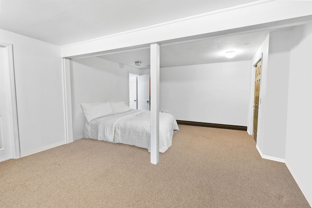 carpeted bedroom with baseboards