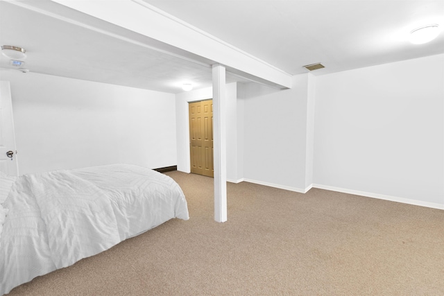 bedroom with visible vents, baseboards, and carpet floors