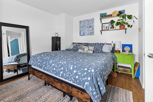 bedroom featuring wood finished floors