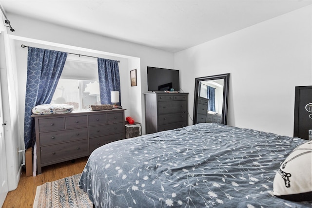 bedroom with wood finished floors