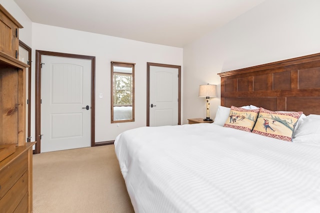 bedroom featuring light colored carpet