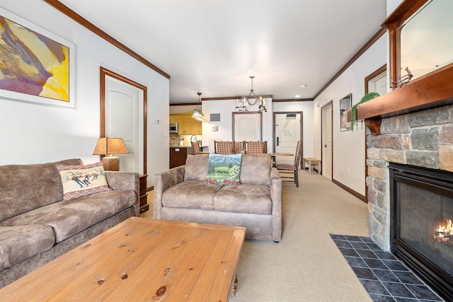 living room featuring a stone fireplace, crown molding, dark colored carpet, baseboards, and a chandelier