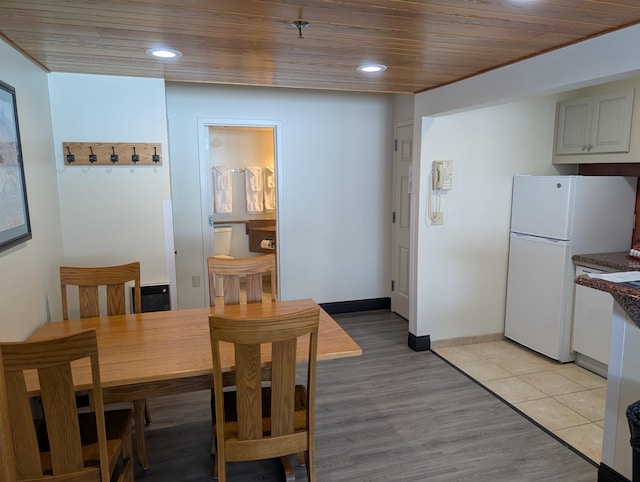 dining area featuring recessed lighting, wooden ceiling, baseboards, and light wood-style floors