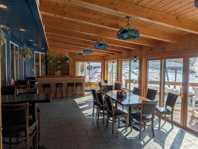 sunroom featuring wooden ceiling and beamed ceiling