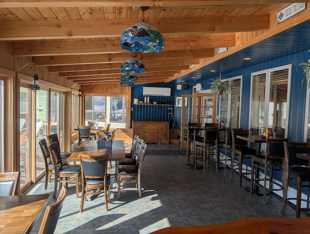 view of patio / terrace featuring outdoor dining space and a wall mounted air conditioner