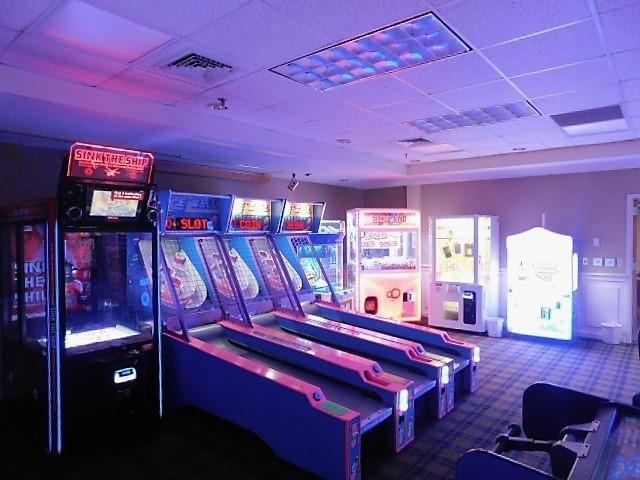 recreation room featuring visible vents and a paneled ceiling