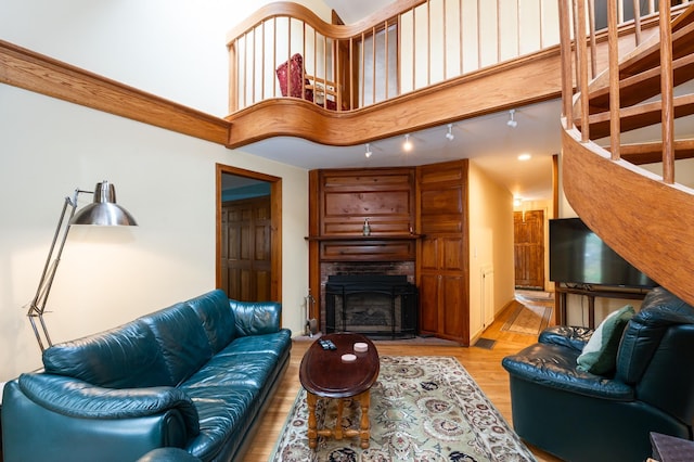 39 Birch Glen Dr, Bennington, NH 03442 - living room featuring a fireplace with raised hearth and light wood-style flooring