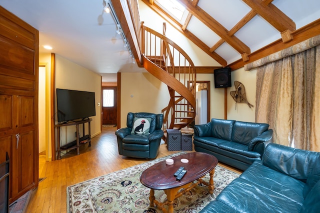 39 Birch Glen Dr, Bennington, NH 03442 - living room with stairs, lofted ceiling with skylight, and light wood-type flooring