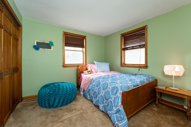 39 Birch Glen Dr, Bennington, NH 03442 - carpeted bedroom featuring baseboards, a closet, and a textured ceiling