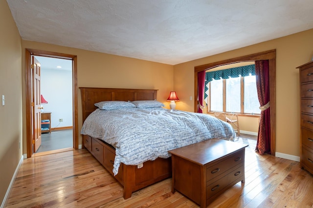 39 Birch Glen Dr, Bennington, NH 03442 - bedroom with light wood-style flooring, baseboards, and a textured ceiling