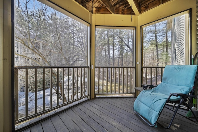 sunroom / solarium with beam ceiling and wooden ceiling