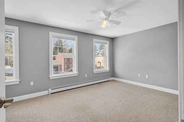 unfurnished room with baseboards, carpet floors, baseboard heating, and ceiling fan