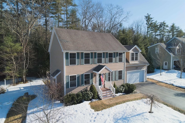 colonial home with aphalt driveway