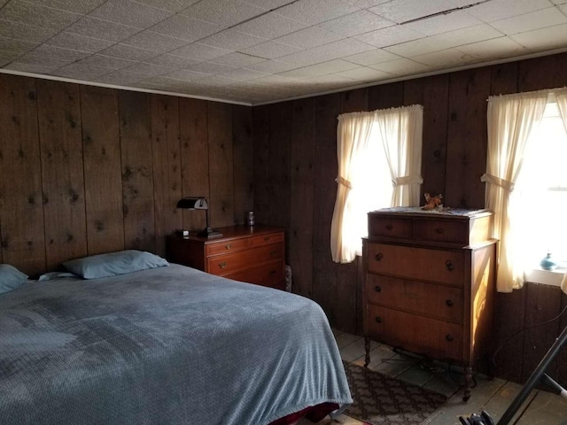 bedroom with wood walls