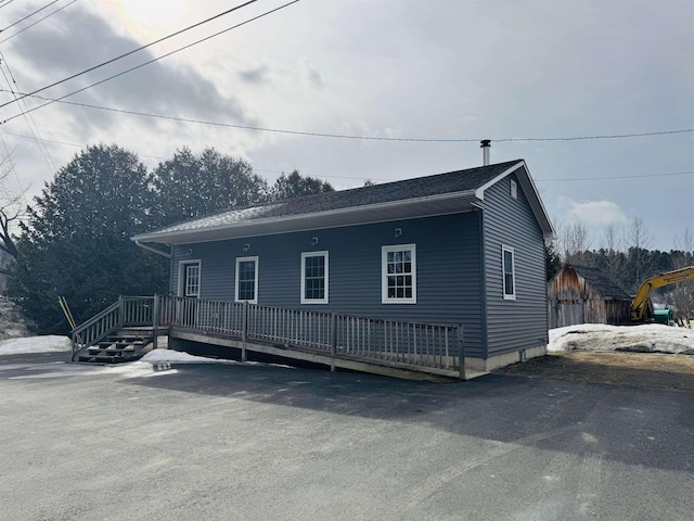 view of front of home with a wooden deck