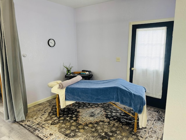 bedroom featuring baseboards